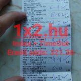 Kézzel felírt eredményekkel ellátott nyomtatott sportfogadási szelvény piros 1x2.hu vízjellel.